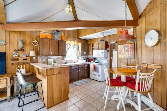 kitchen featuring light tile patterned flooring, tile countertops, vaulted ceiling with beams, a kitchen breakfast bar, and white appliances