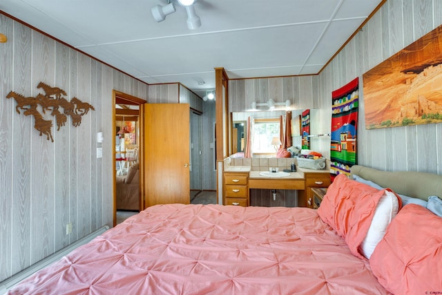 bedroom with wood walls