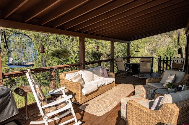 wooden terrace with an outdoor hangout area