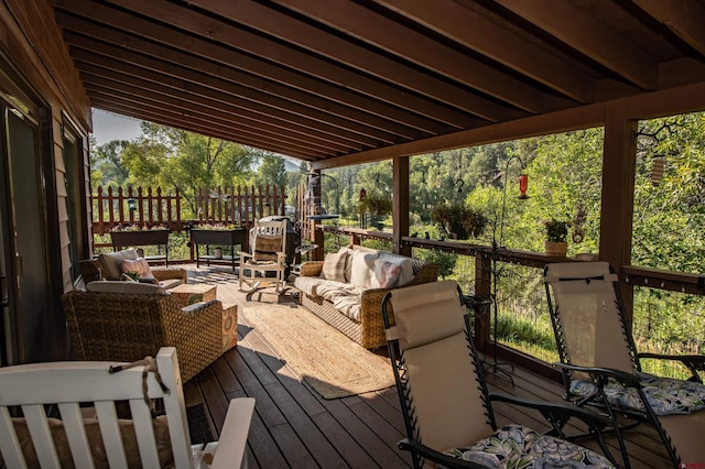 wooden terrace featuring outdoor lounge area