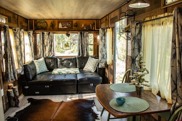 sunroom featuring wooden ceiling