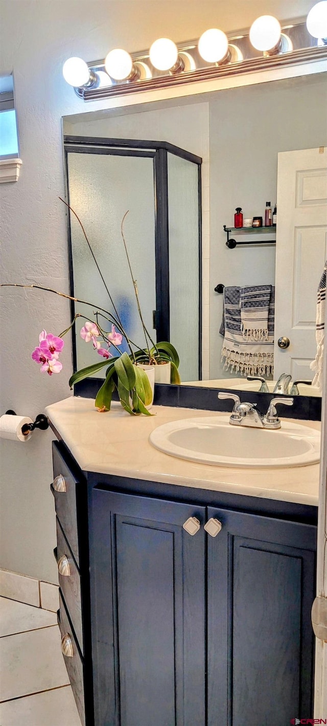 bathroom featuring vanity and tile patterned flooring