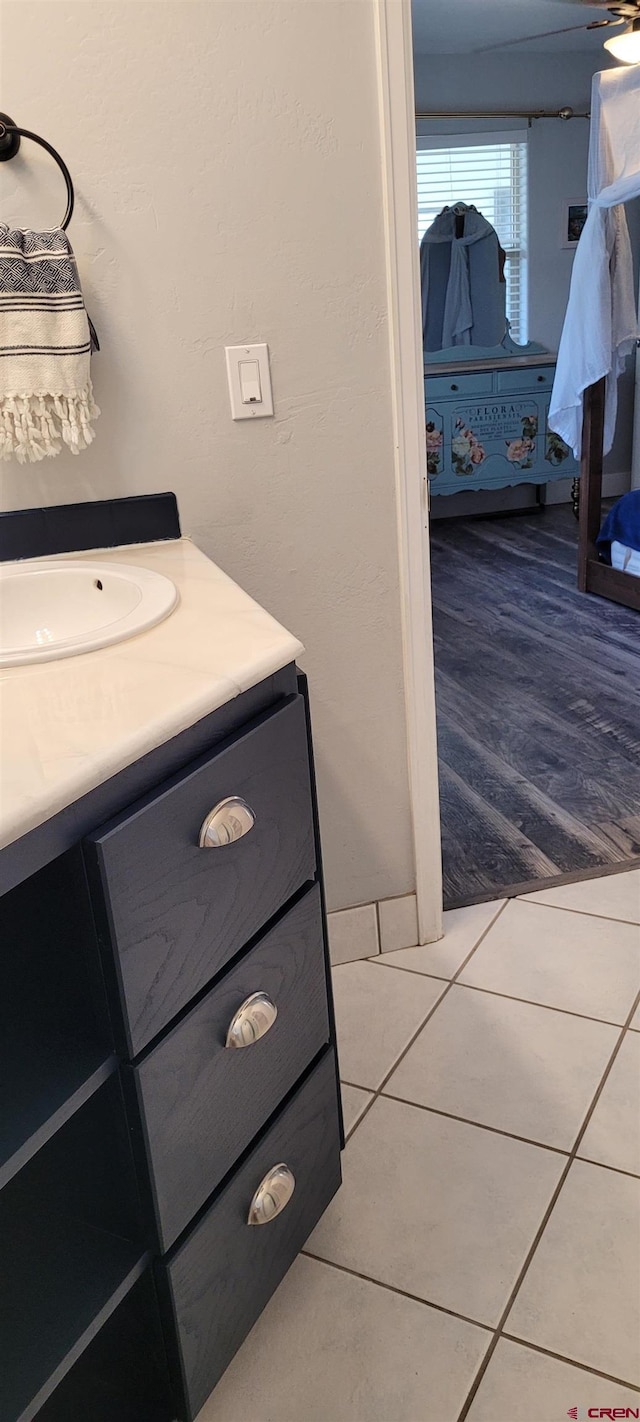 bathroom with tile patterned flooring and vanity