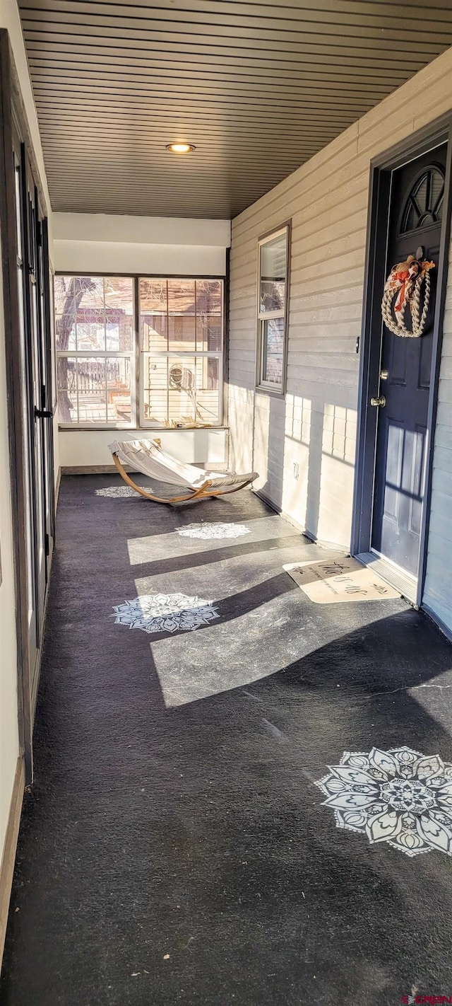 unfurnished sunroom featuring plenty of natural light