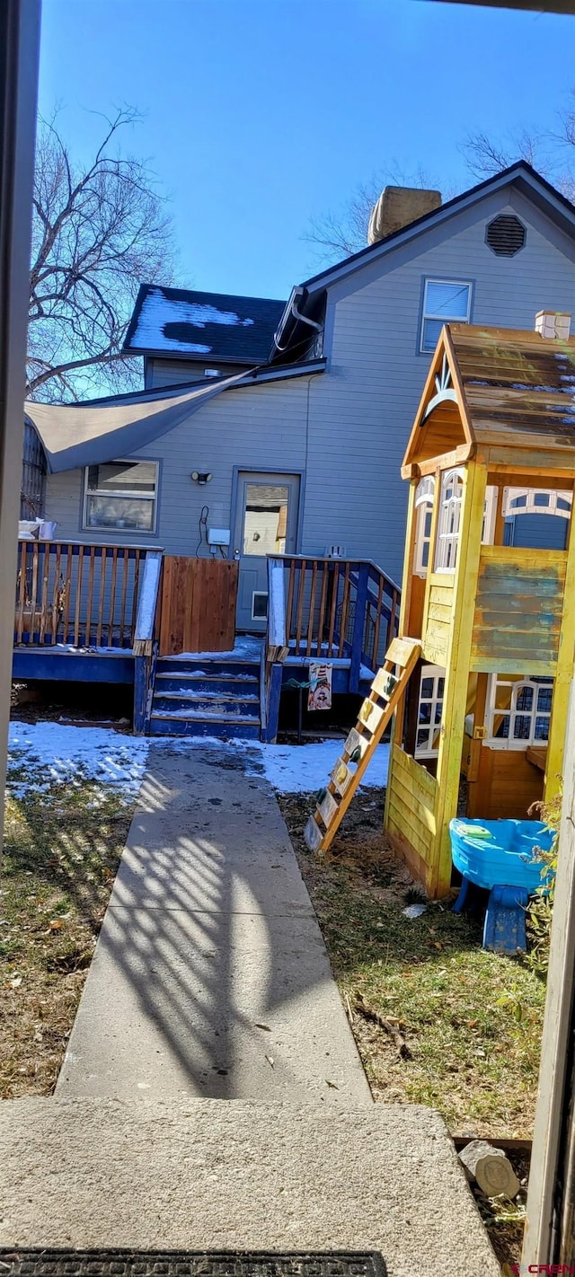 view of front of property with a wooden deck