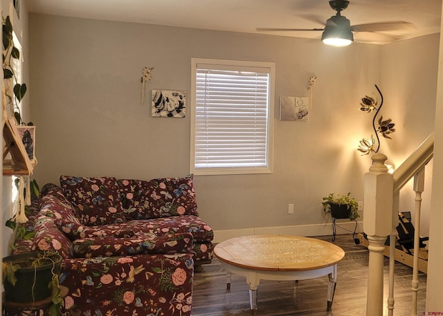 living area with wood-type flooring and ceiling fan