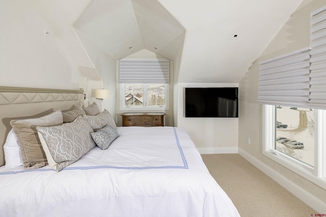 carpeted bedroom with vaulted ceiling