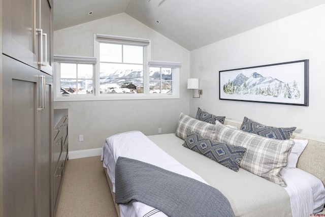 carpeted bedroom with vaulted ceiling