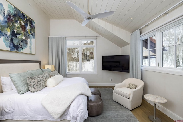 bedroom featuring lofted ceiling, hardwood / wood-style floors, wood ceiling, and ceiling fan