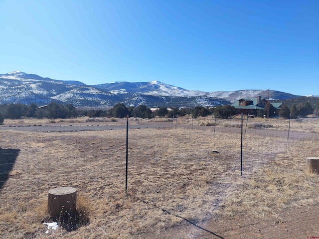 property view of mountains featuring a rural view