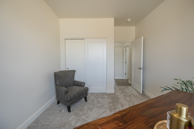 living area with light carpet