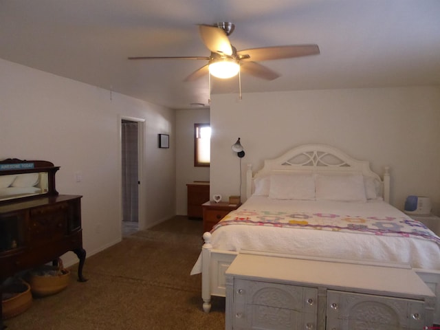 bedroom with ceiling fan and dark carpet