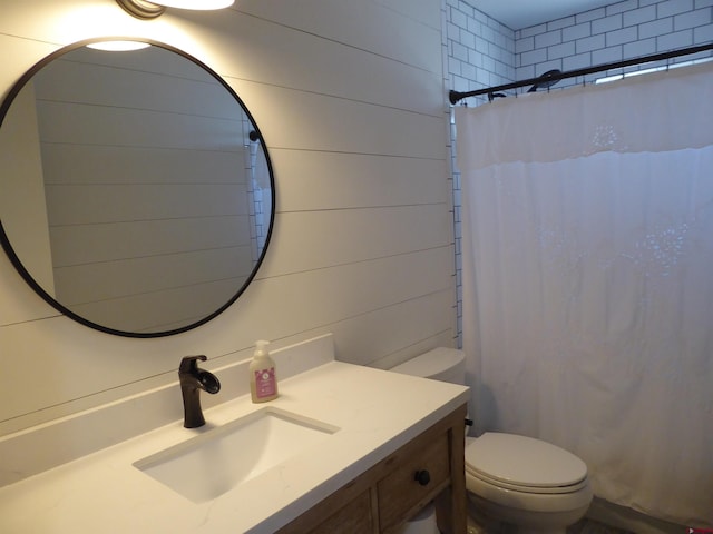 bathroom featuring vanity, a shower with curtain, toilet, and wood walls