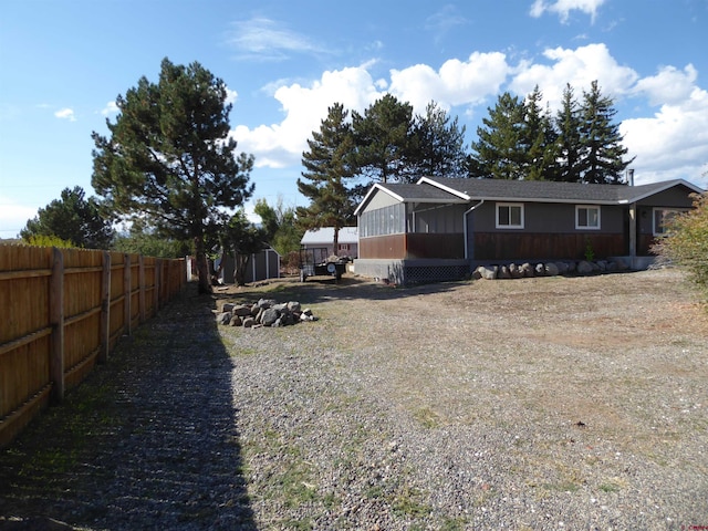 view of yard with a sunroom