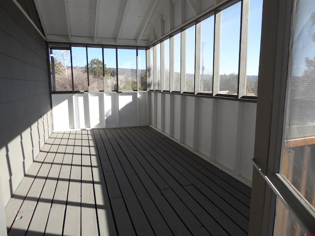 unfurnished sunroom with vaulted ceiling