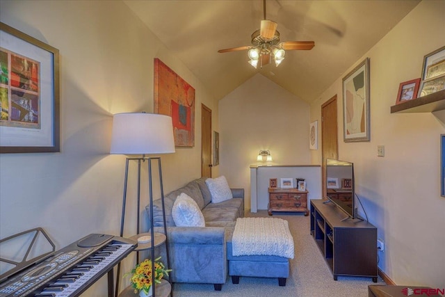 living area with vaulted ceiling, carpet, and ceiling fan