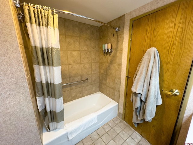 bathroom featuring tile patterned flooring and shower / bath combo