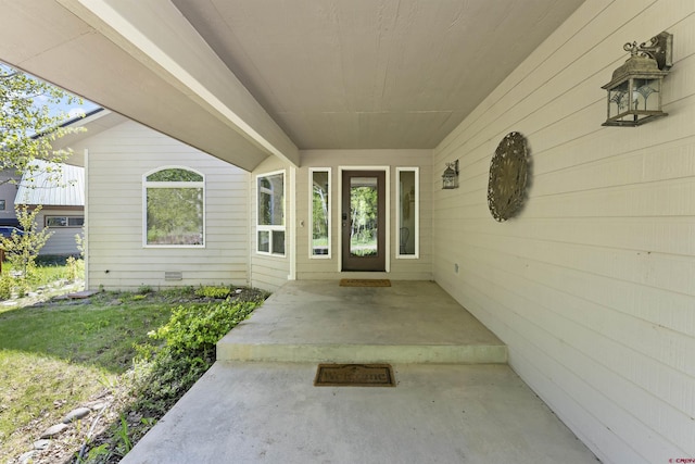 property entrance with a patio