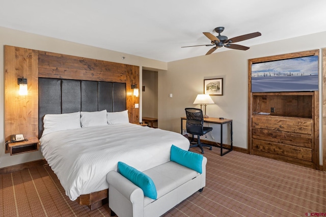 bedroom with ceiling fan and carpet flooring