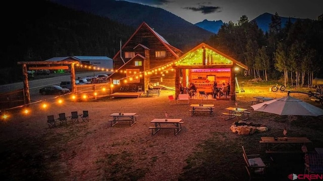 playground at night featuring a mountain view