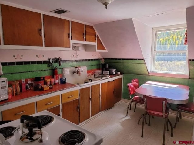 kitchen featuring range and sink