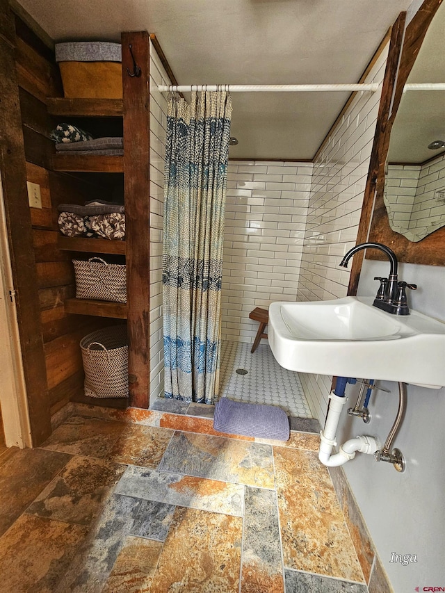 bathroom with a shower with curtain and sink