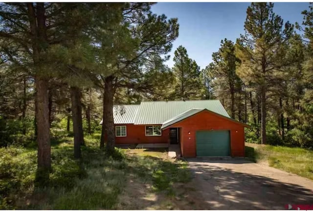 view of side of home featuring a garage