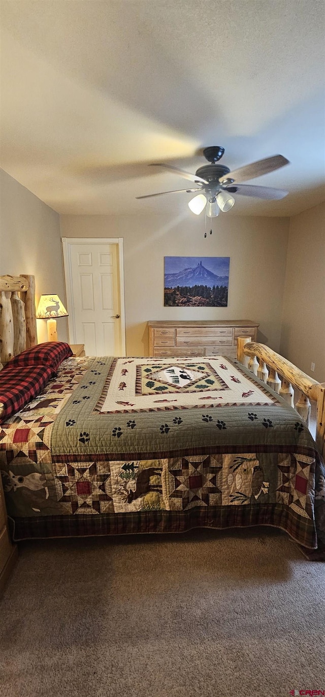 bedroom featuring ceiling fan and carpet floors