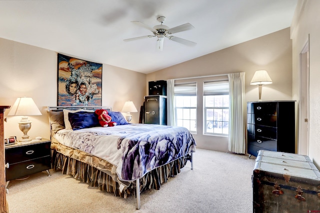 carpeted bedroom with ceiling fan and lofted ceiling