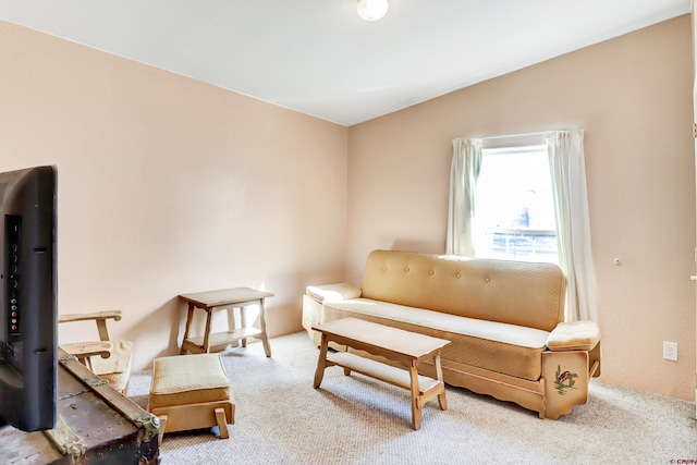 living area with vaulted ceiling and light carpet