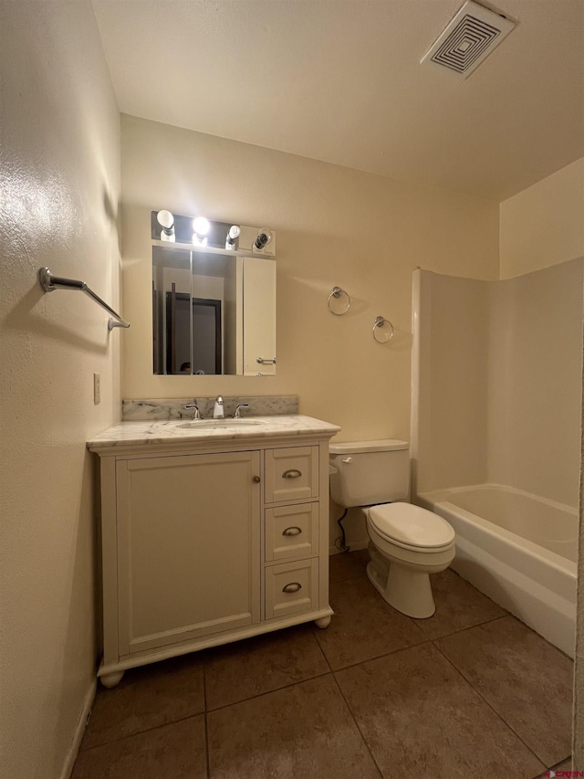 1135 Florida Rd Unit 28, Durango, CO 81301 - full bathroom featuring toilet, shower / tub combination, visible vents, tile patterned flooring, and vanity