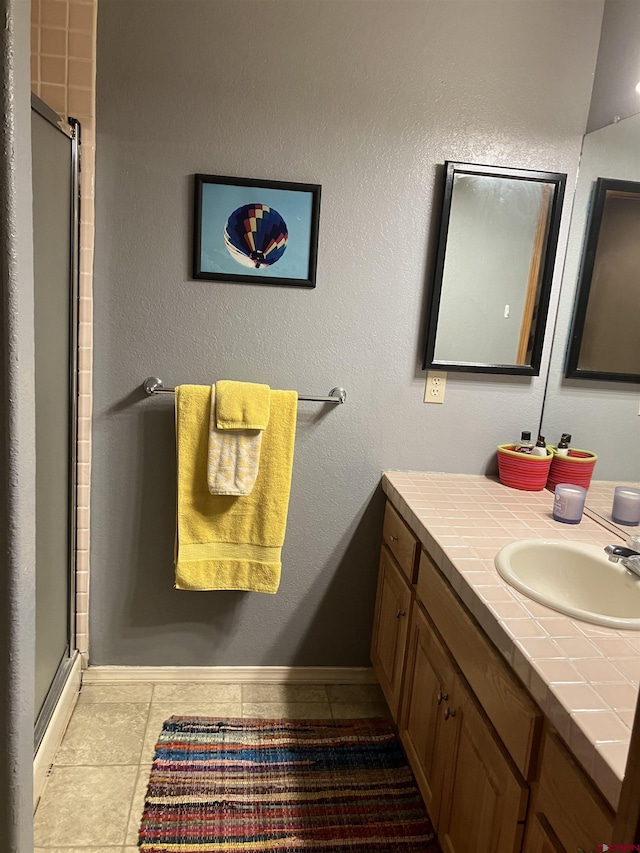 bathroom with vanity and an enclosed shower