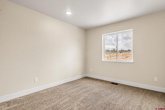 empty room featuring carpet flooring