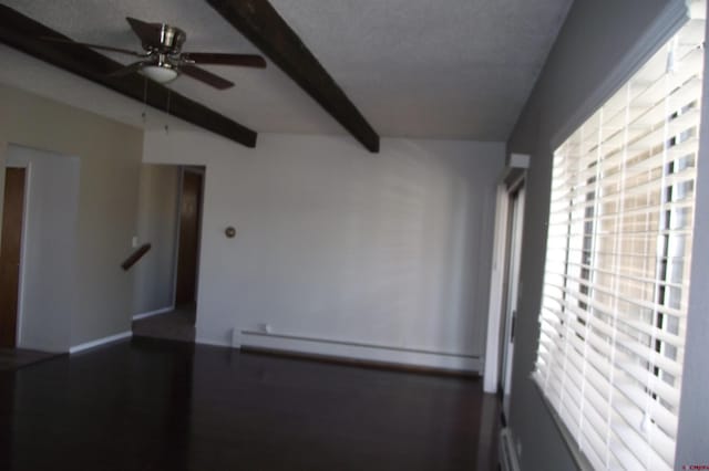 empty room featuring wood-type flooring, ceiling fan, baseboard heating, a textured ceiling, and beam ceiling