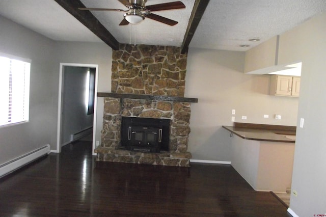 unfurnished living room featuring beam ceiling, ceiling fan, dark wood-type flooring, and baseboard heating