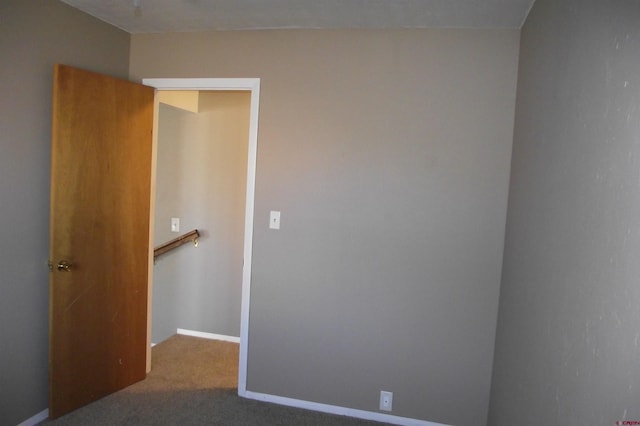 empty room with carpet flooring