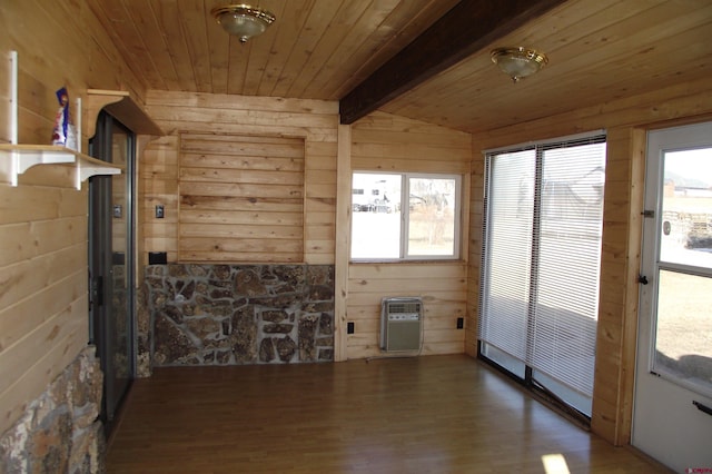 unfurnished sunroom with a healthy amount of sunlight, vaulted ceiling with beams, and wood ceiling