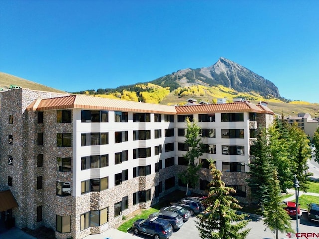 view of building exterior with a mountain view