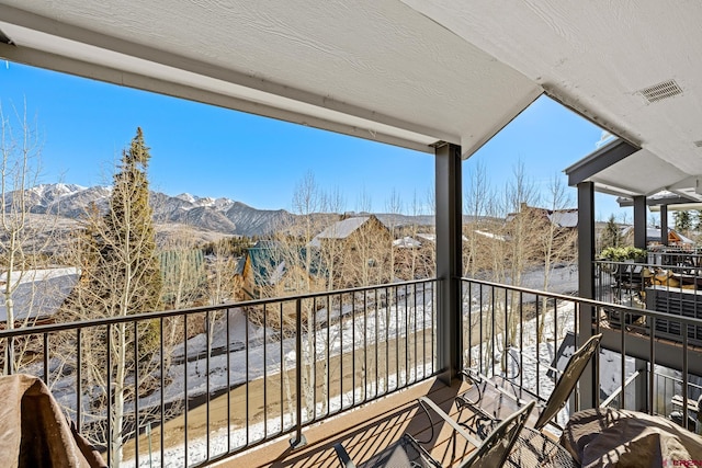 balcony featuring a mountain view