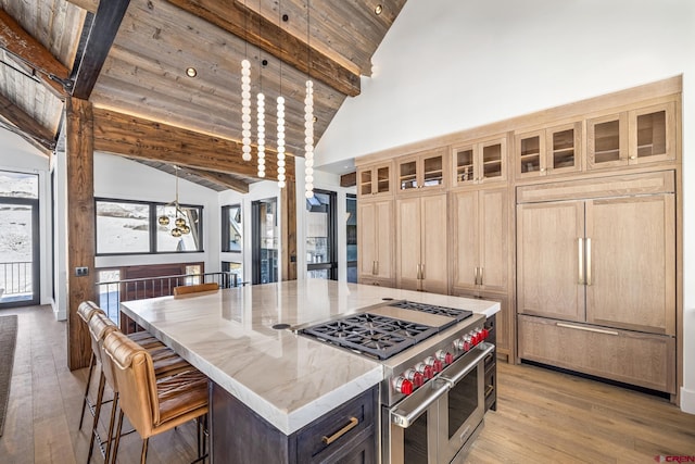 kitchen featuring a kitchen island, high quality appliances, hanging light fixtures, wooden ceiling, and beam ceiling