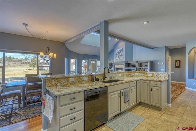 kitchen with lofted ceiling, sink, light stone countertops, and black dishwasher