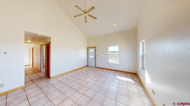 tiled spare room featuring high vaulted ceiling and ceiling fan