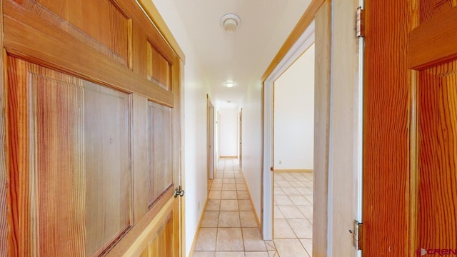 hallway with light tile patterned floors