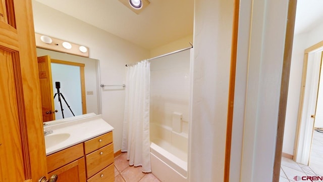 bathroom with tile patterned flooring, shower / tub combo, and vanity