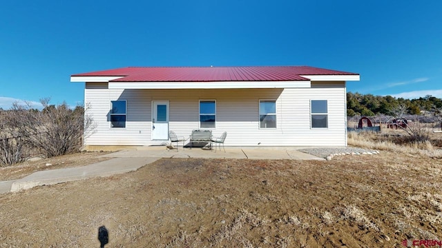 rear view of house featuring a patio area