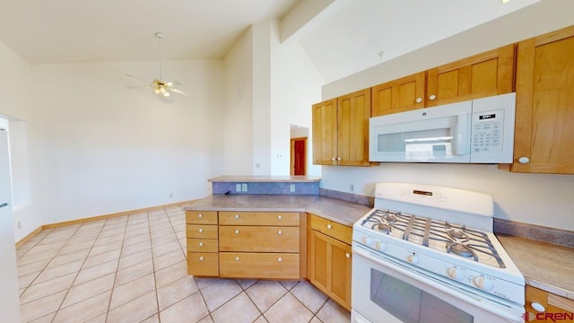 kitchen featuring ceiling fan, white appliances, high vaulted ceiling, and light tile patterned floors