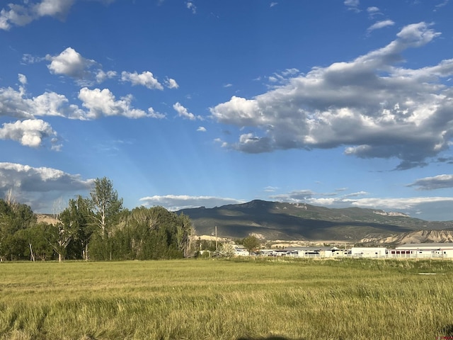 mountain view featuring a rural view