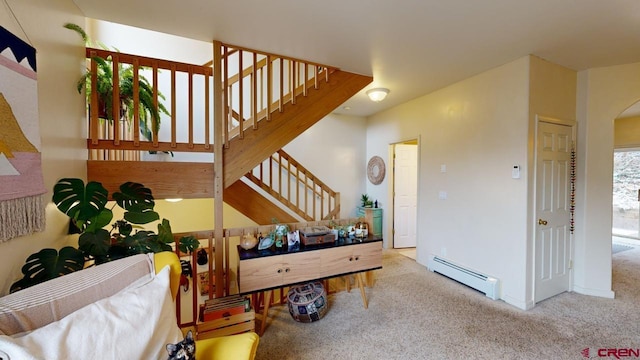 interior space featuring a baseboard radiator and carpet floors