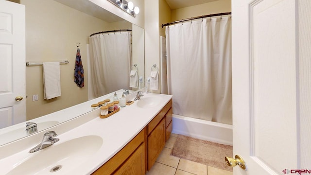 bathroom with shower / tub combo, vanity, and tile patterned flooring