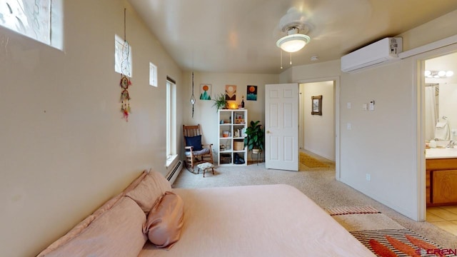 bedroom featuring sink, ensuite bath, baseboard heating, a wall mounted AC, and light carpet